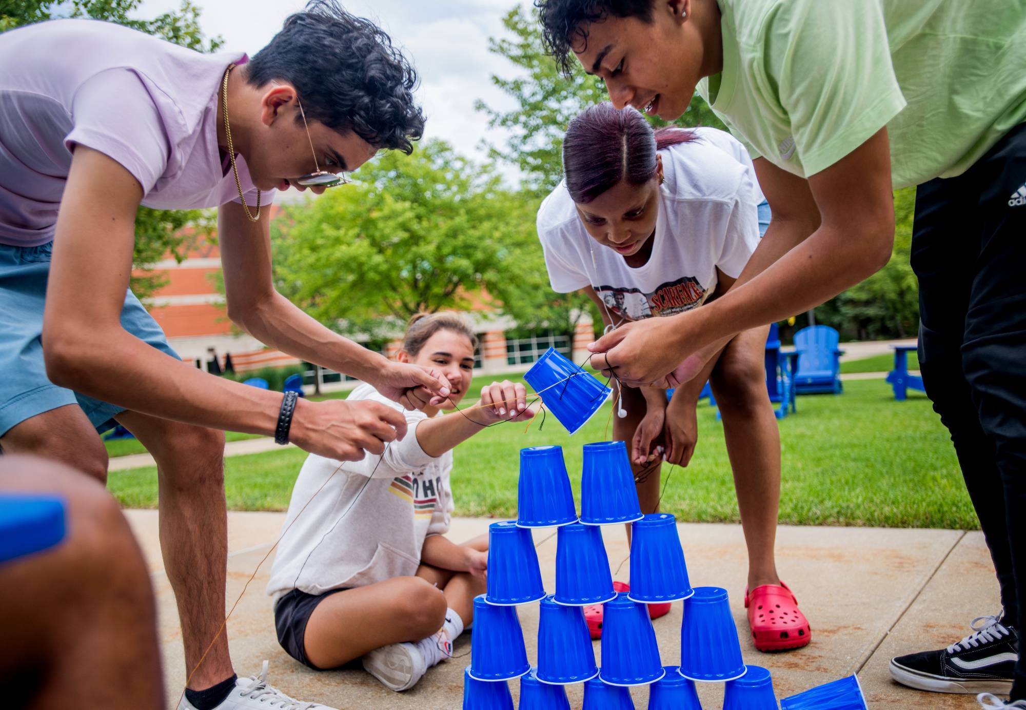 Students stacking cups as a a group